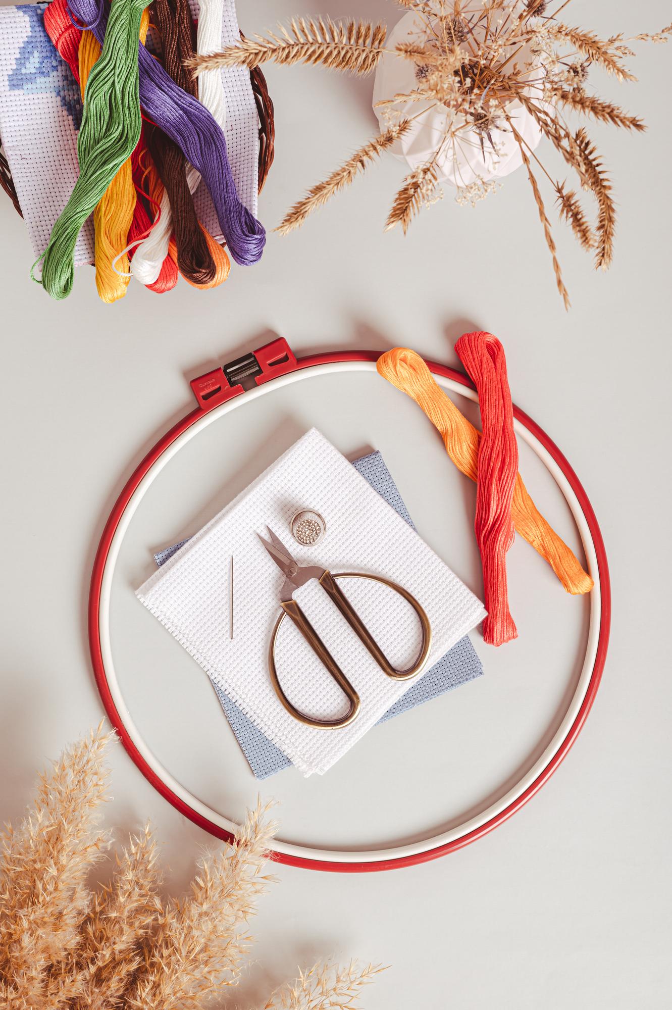 Assorted embroidered samples laid out on table